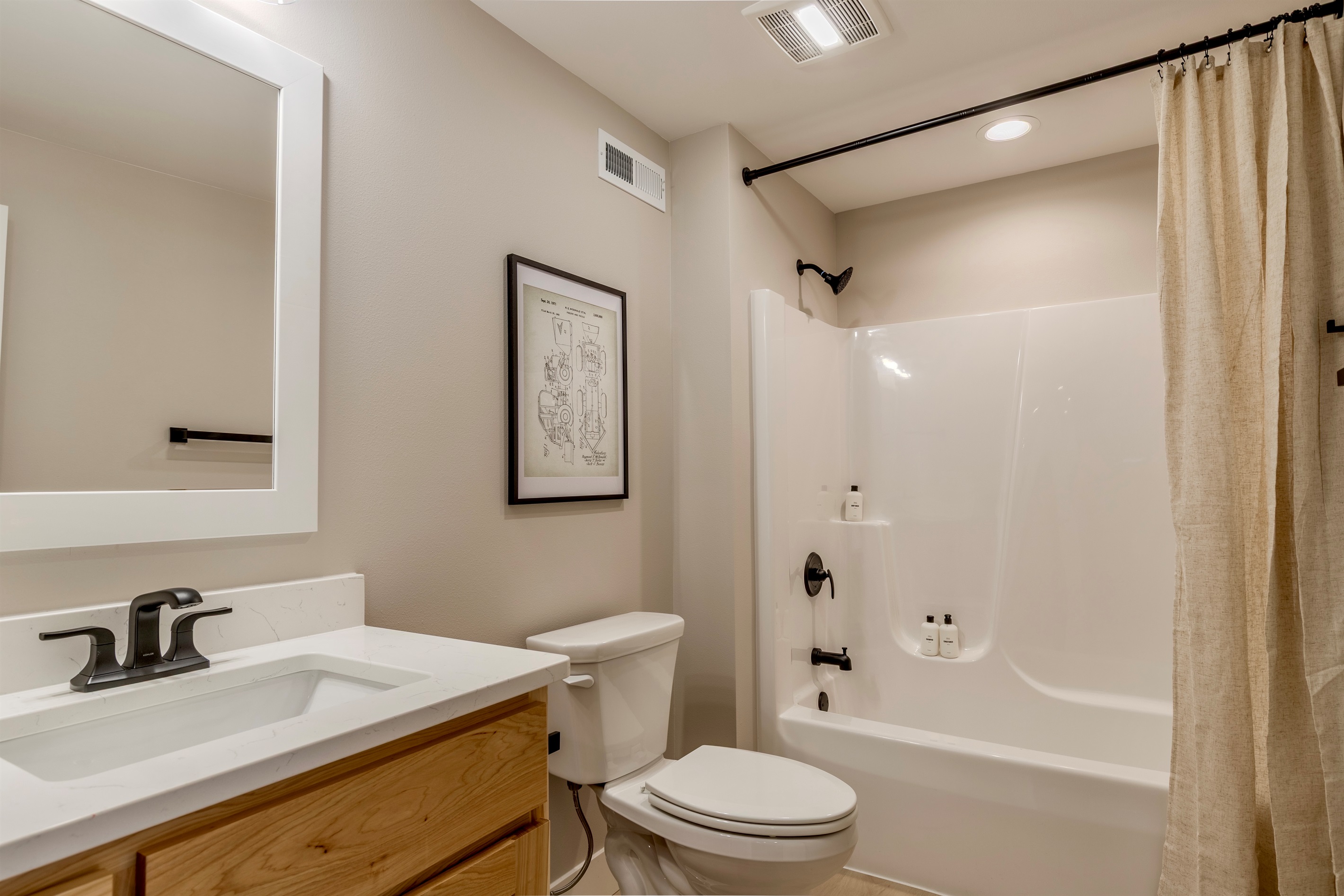 Downstairs bathroom with shower/tub combo.  All our bathrooms come with shampoo, conditioner & body wash for our guests.