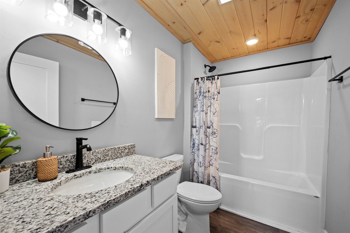 Additional full bathroom with modern fixtures and clean design, making mornings easy for families and groups.
