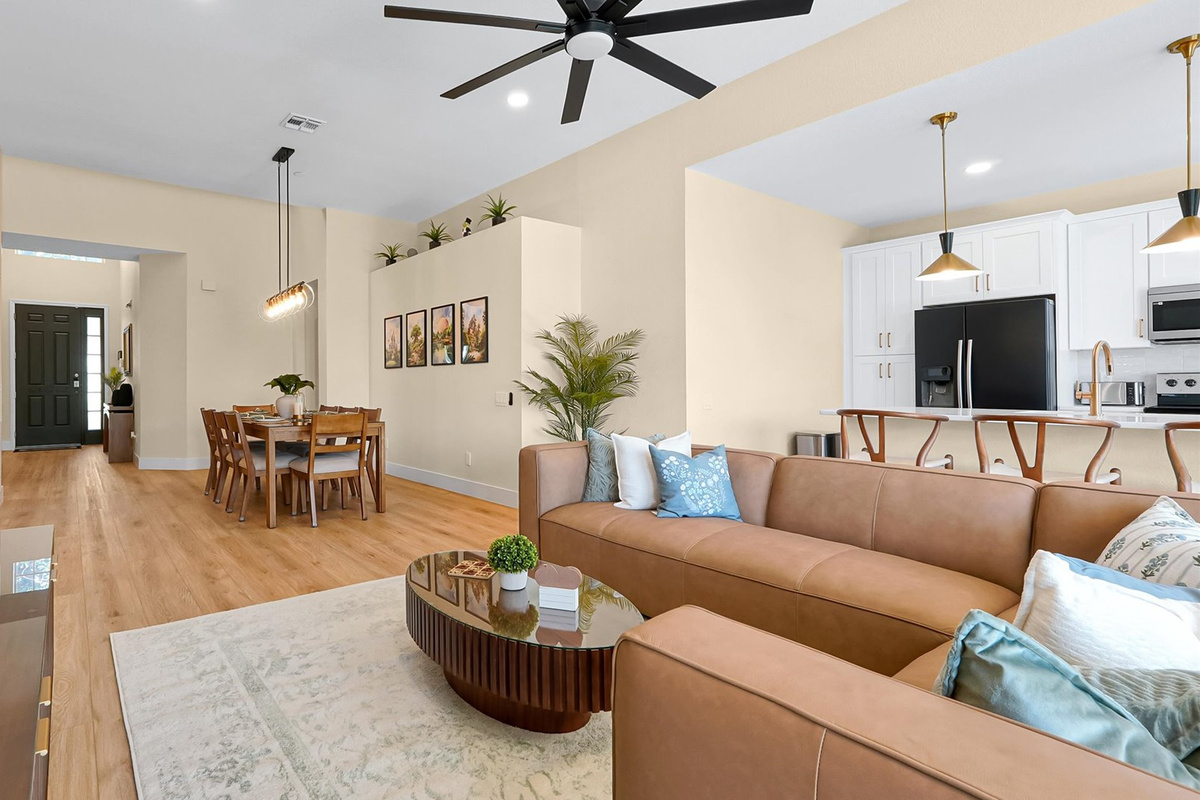Open-Concept Living Area: Bright, spacious layout connecting the living room, dining room and fully renovated kitchen.