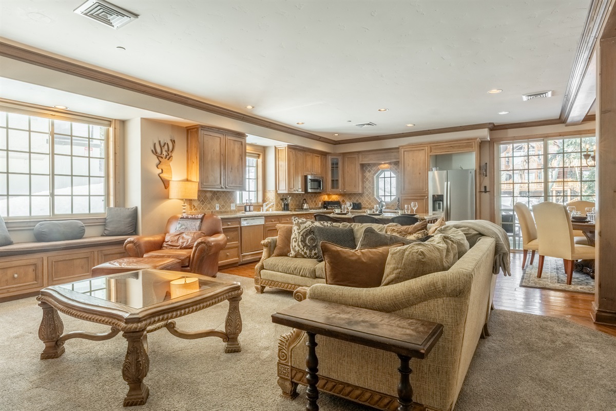 Plush seating, thoughtful layout, and natural light create a living area that feels spacious and comfortable rather than condo-like.