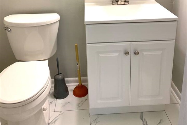 Half-bath, located in the primary bedroom.