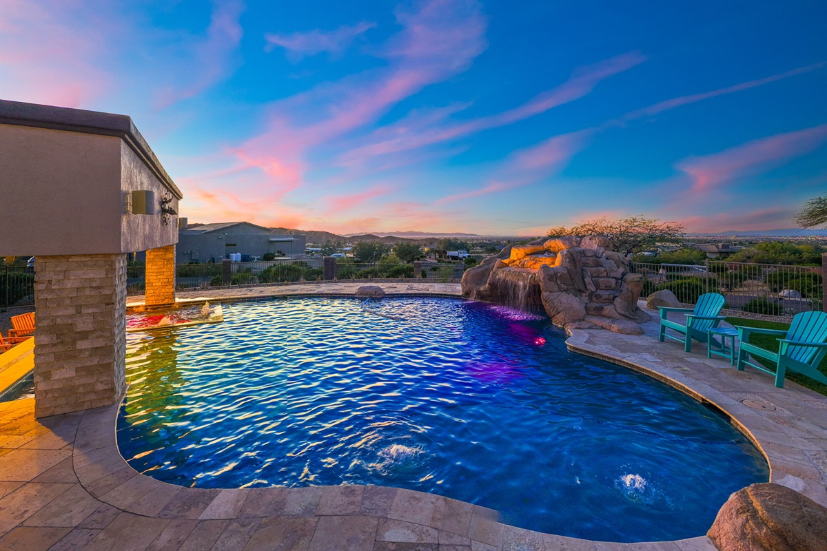 Slip into the pool as the sky paints itself in soft pinks and purples.