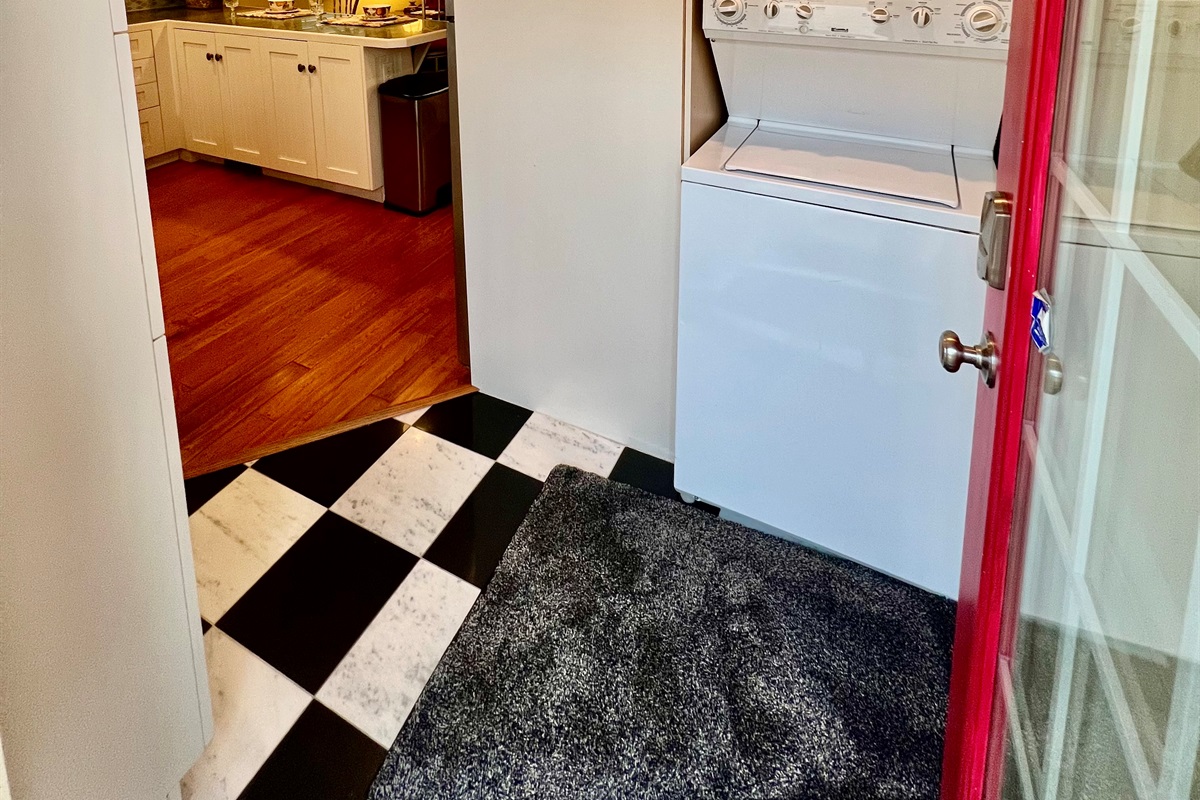 Enjoy the convenience of an in-unit, stacked washer and dryer, located just off the rustic dining area and open-plan living room.