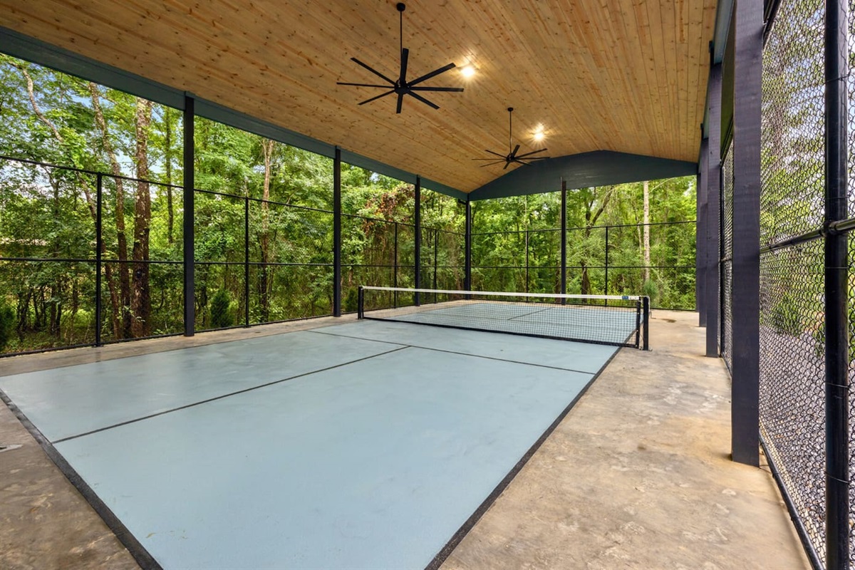 Play rain or shine under this beautiful wooden ceiling featuring two large fans to help keep cool during the heat. 