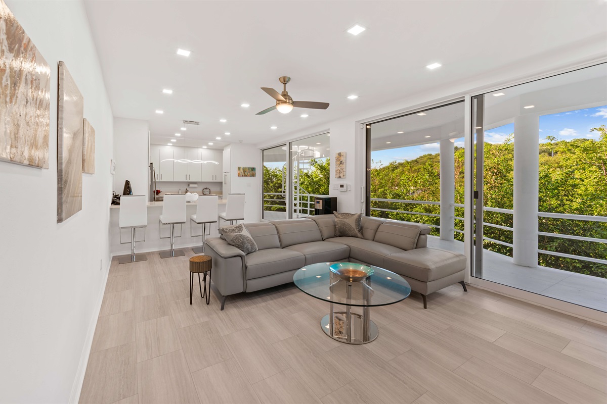 A full living room and kitchen are found in the apartment