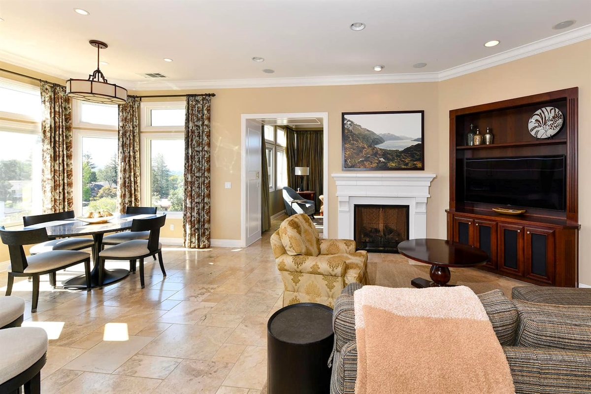 Living area with smart tv next to the kitchen.