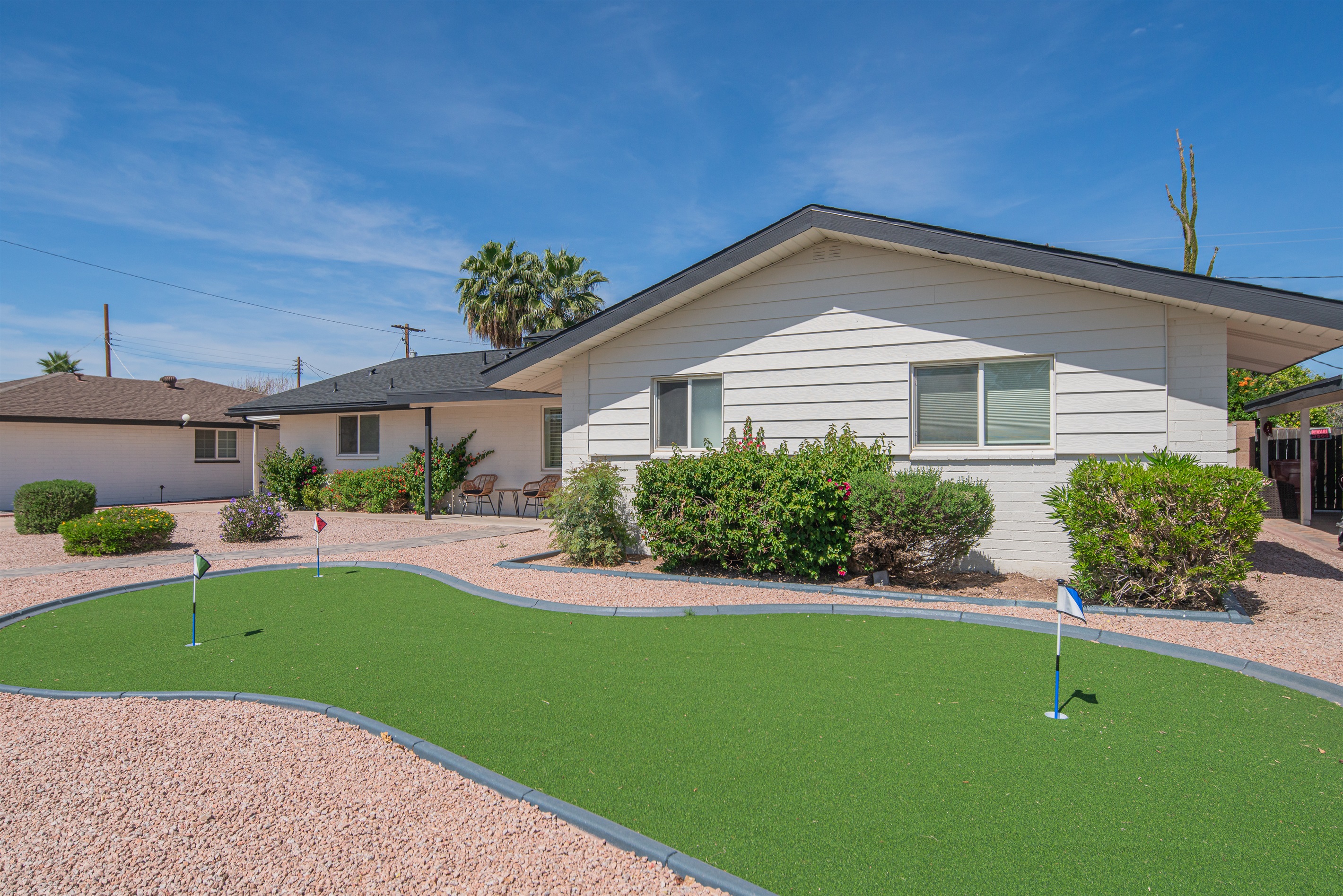 Putting green and front yard space for outdoor fun and relaxation