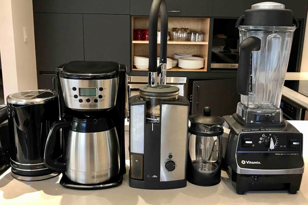 Drip Coffee Maker (10-cup Thermal Carafe)
French Press, Coffee Grinder, VitaMix Blender, Electric Kettle,  Nespresso Machine (small pods), dinnerware for 10.  Dining table seats 10 people.  High chair 