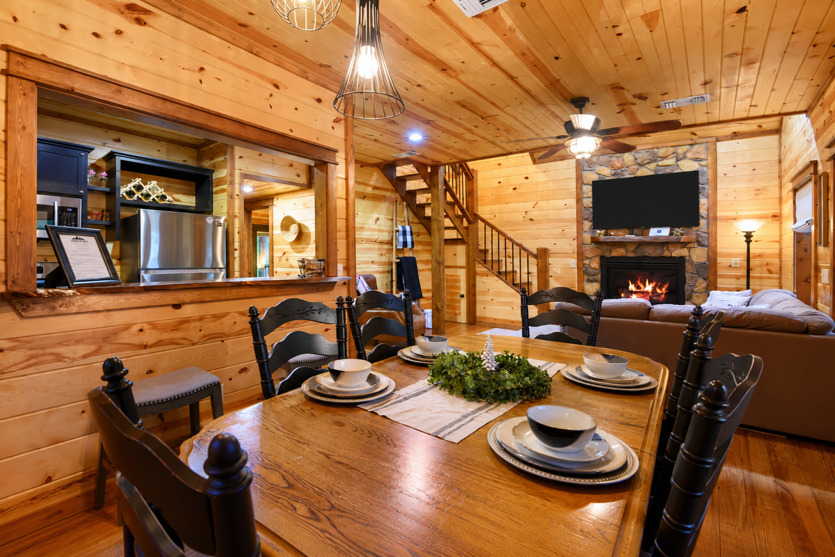 Dining Area: Gather around the stunning wooden table and enjoy meals in this charming space!