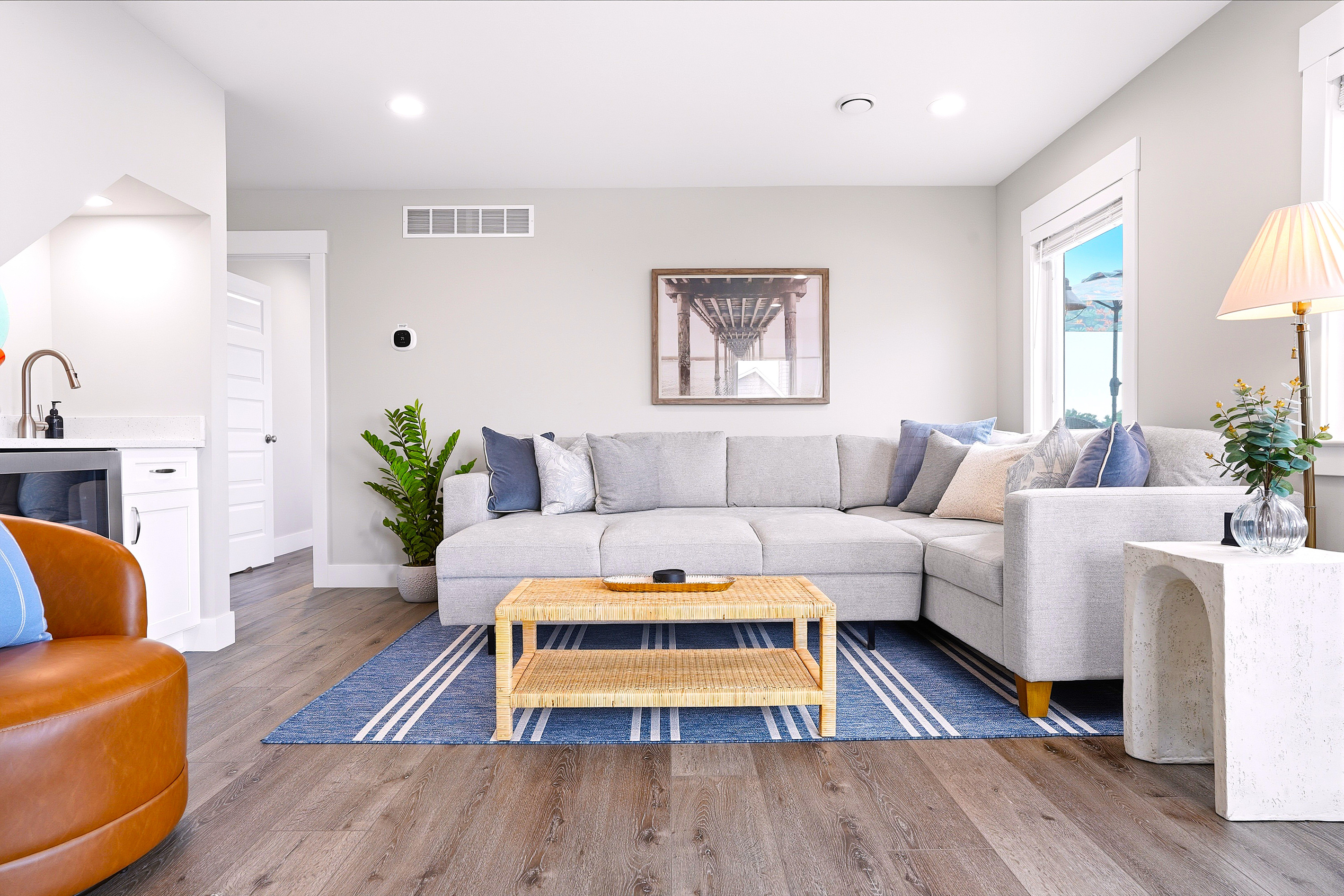 Stretch out on the oversized sectional, which easily converts into a pull-out sofa bed, making this space ideal for movie nights, extra guests, or simply unwinding after a day on the water.