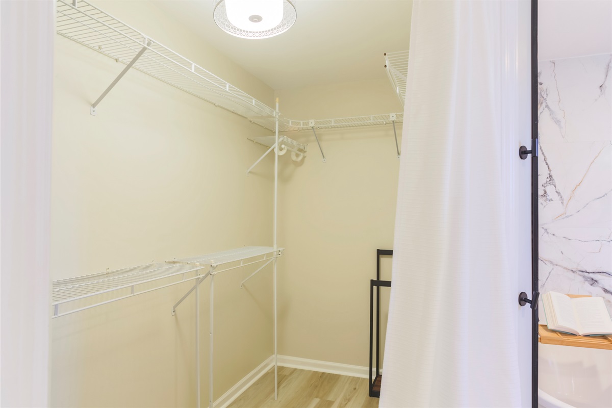 Generous walk-in closet with ample storage for your stay.