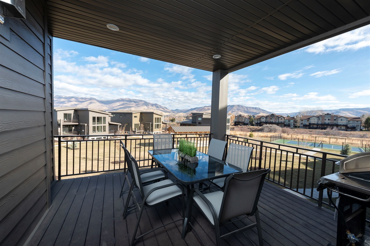 Dine outdoors on the covered deck with fresh mountain air and stunning scenery