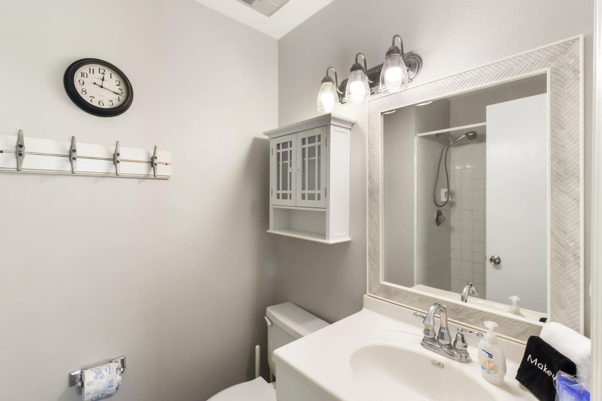 Hang everything up in the master bath storage organizer &mdash; this is the kind of detail that makes a real stay feel like home.