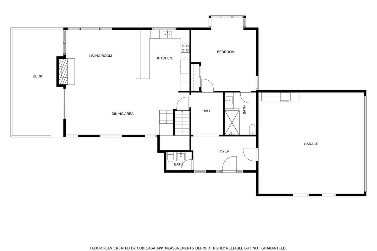 Main level floor plan with living room, kitchen, dining area, bedroom and deck