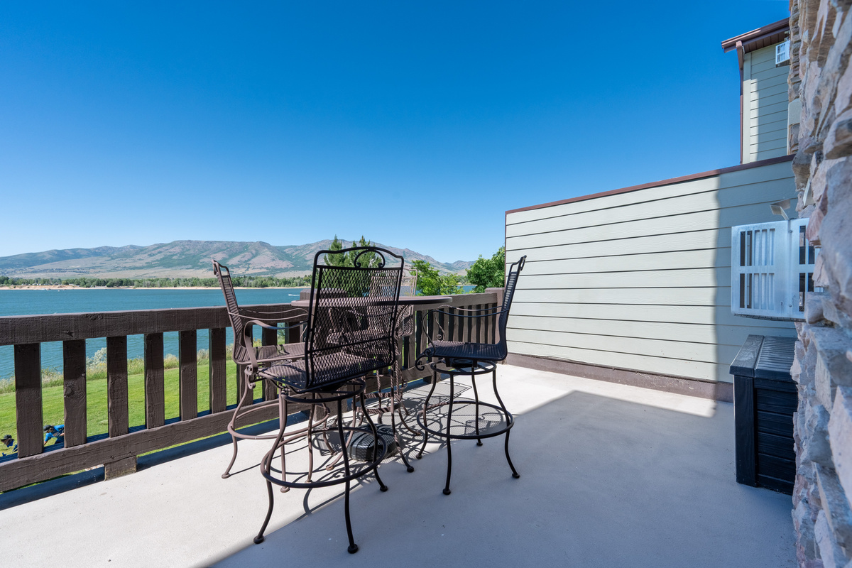 Spacious private deck with panoramic views of Pineview Reservoir and surrounding mountains.