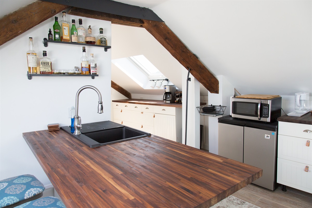 Kitchenette: Modern design with rustic accents, perfect for culinary adventures and cocktails!