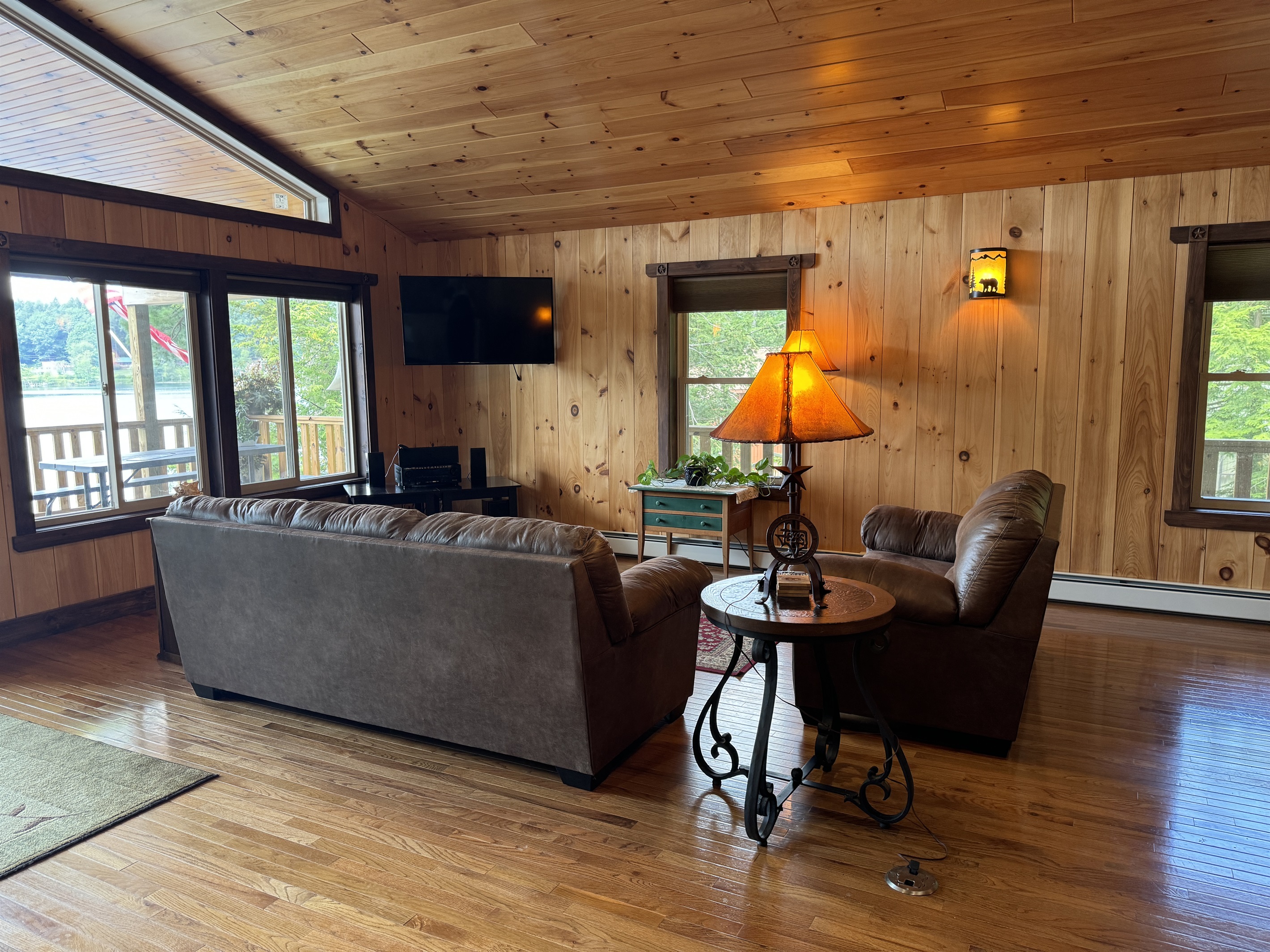Living area with large windows facing the water