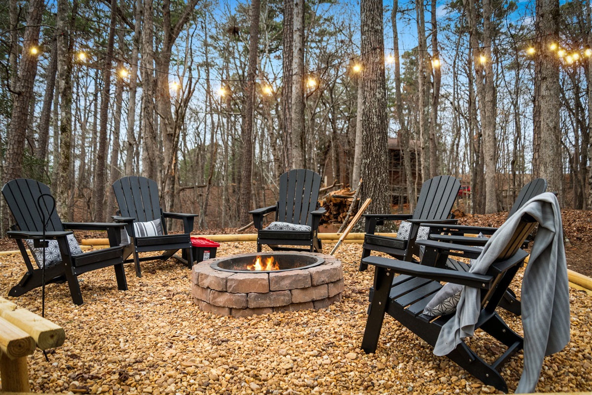 Outdoor fire pit area offers a warm and inviting space perfect for gathering with friends and family.