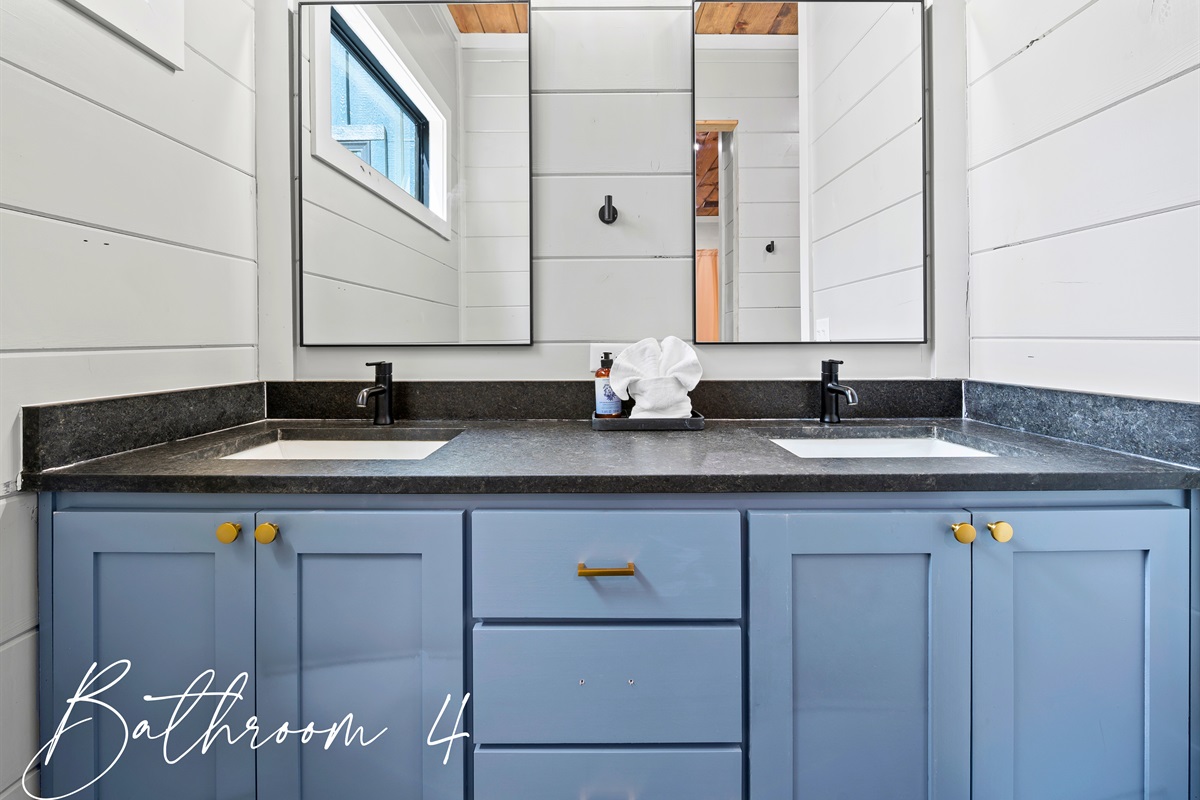 Refresh and recharge in the small house bathroom where sleek modern design meets cozy cabin vibes for your morning and evening routines.