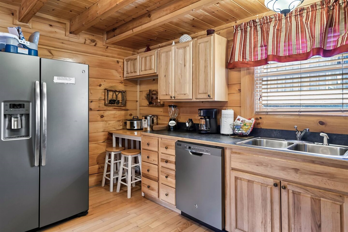 A fully stocked kitchen with all standard items needed for cooking and eating.