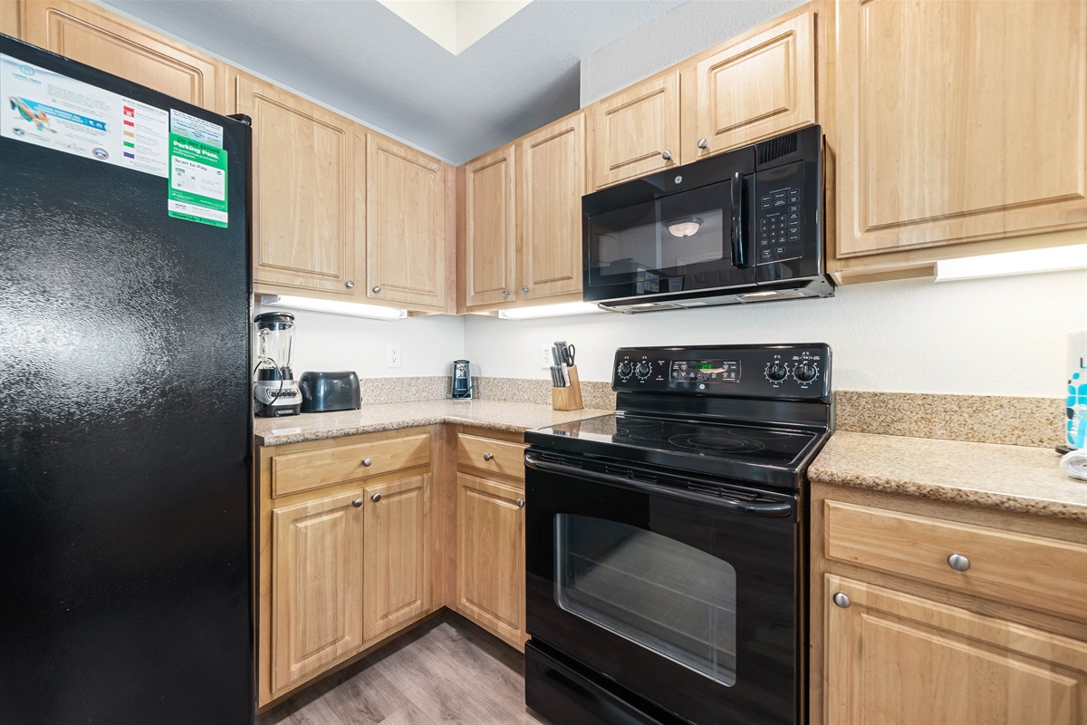 Updated kitchen with stainless steel appliances, and quartz countertops, offering both functionality and aesthetic appeal.