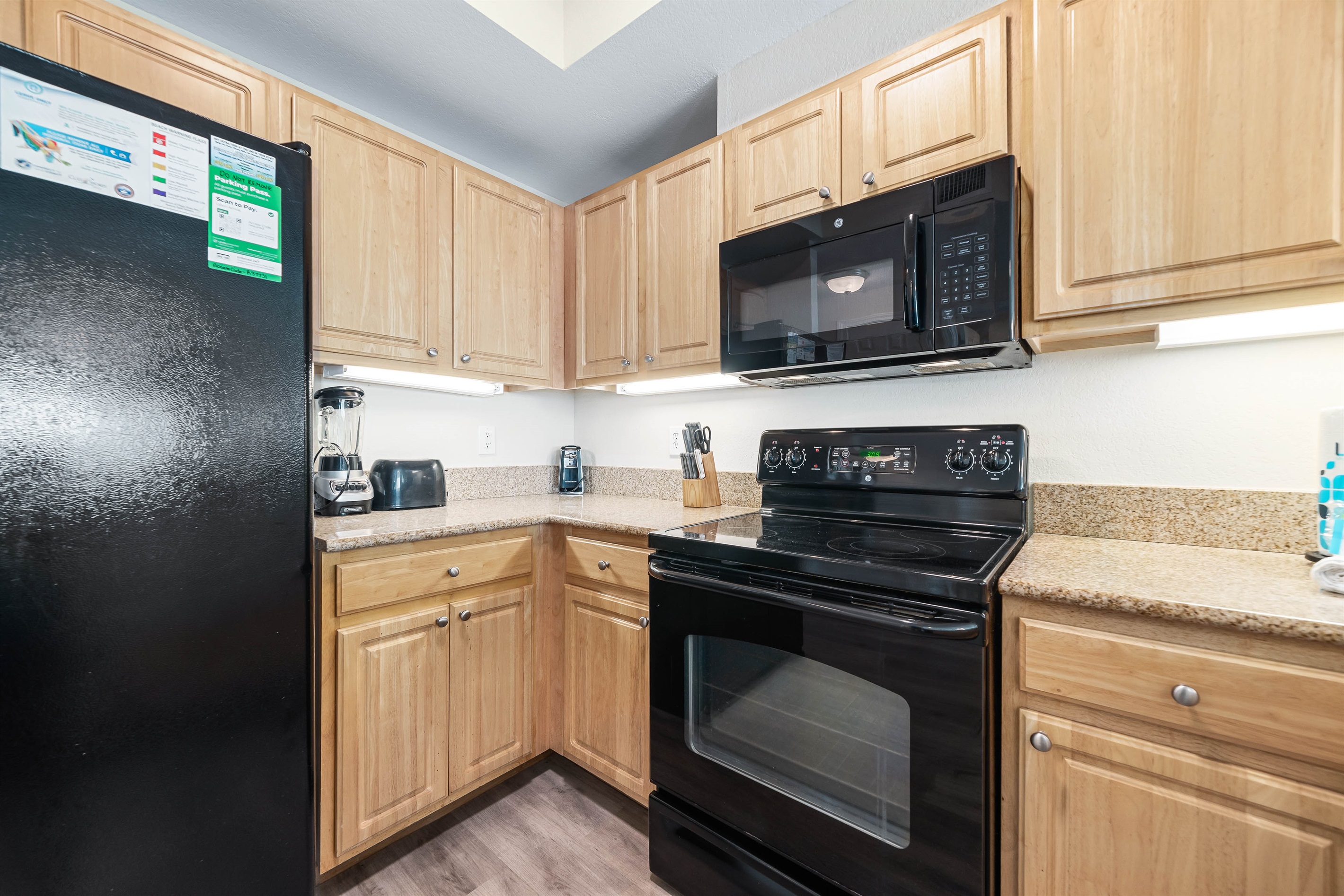 Updated kitchen with stainless steel appliances, and quartz countertops, offering both functionality and aesthetic appeal.