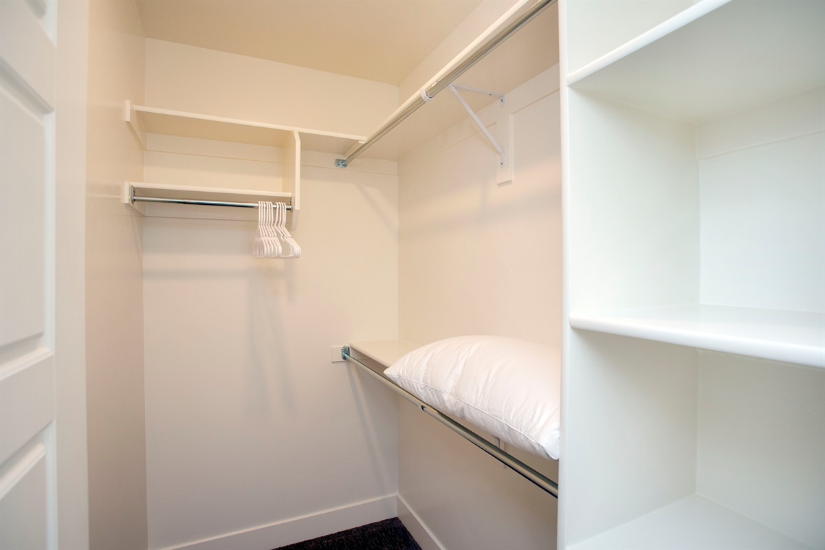 Large walk-in closet with plenty of storage for extended stays.