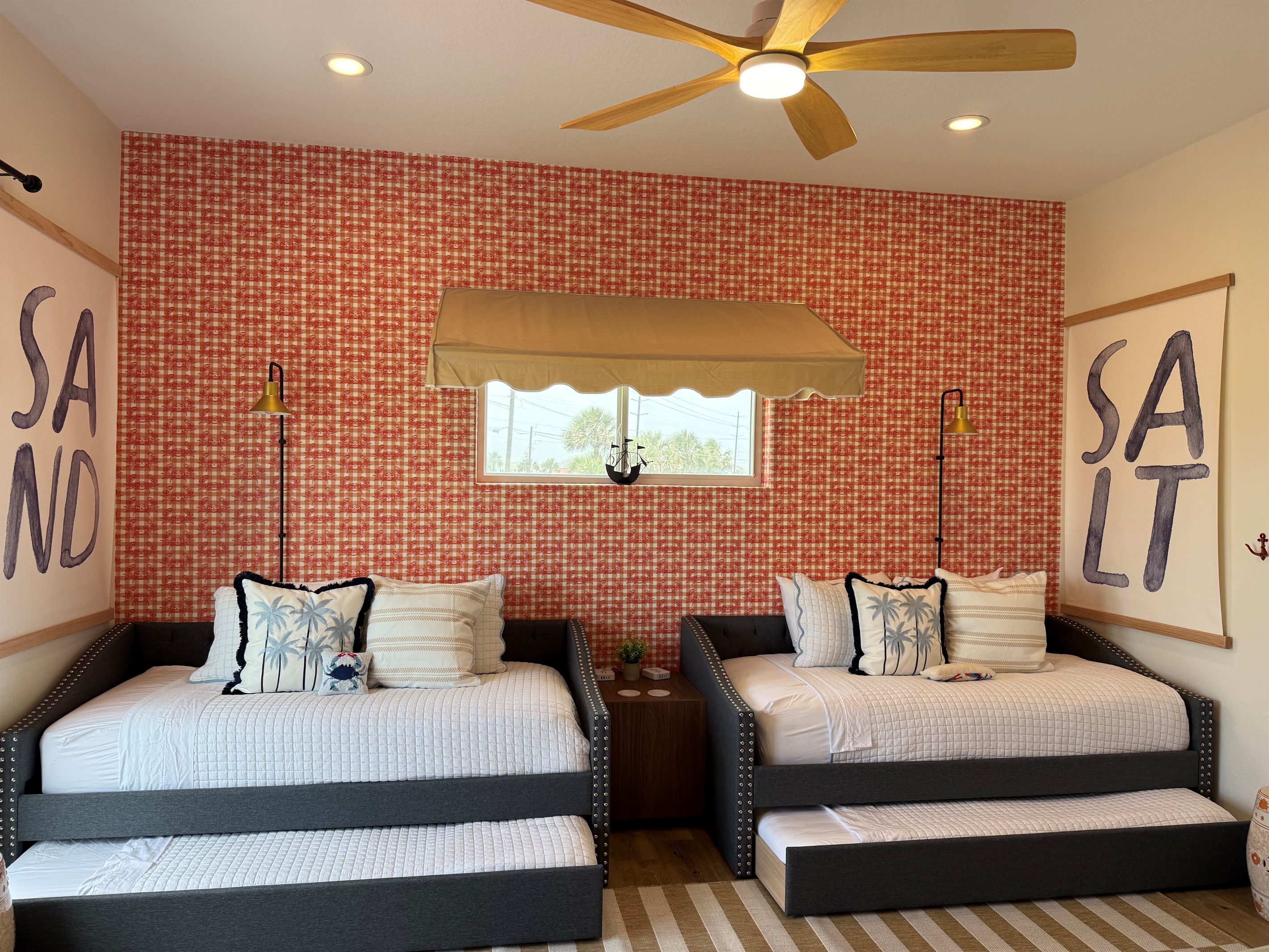 Crab Shack Baby! Two day beds with twin trundles make this room complete! Easy access to the Bay Deck for fabulous sunsets. Tin Roof Rusted! But alas, we have an awning instead. 