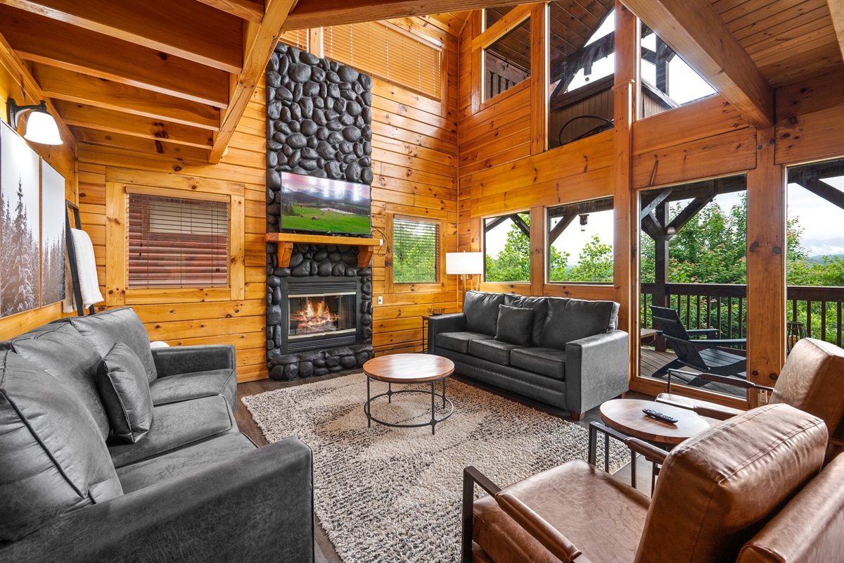 Gather in the open living room with panoramic windows