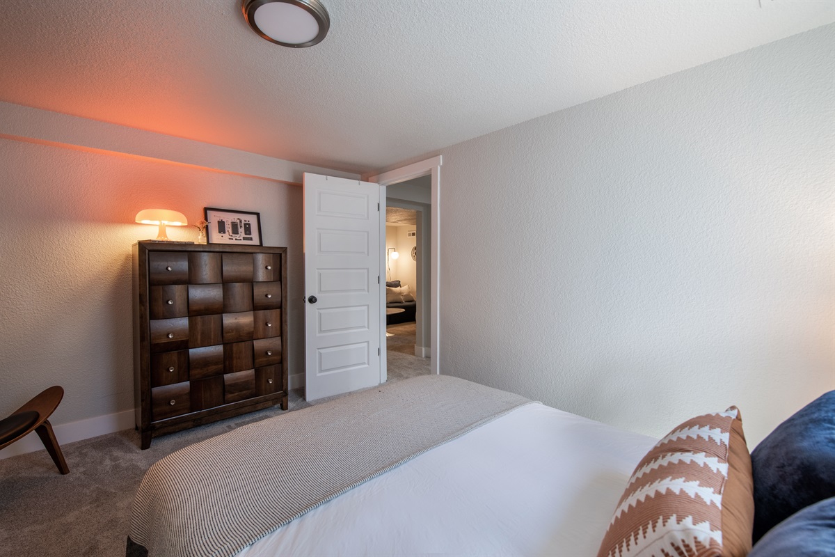 View from window of bedroom 3 into the lower level and movie theater room.