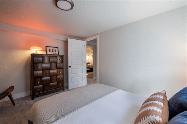 View from window of bedroom 3 into the lower level and movie theater room.