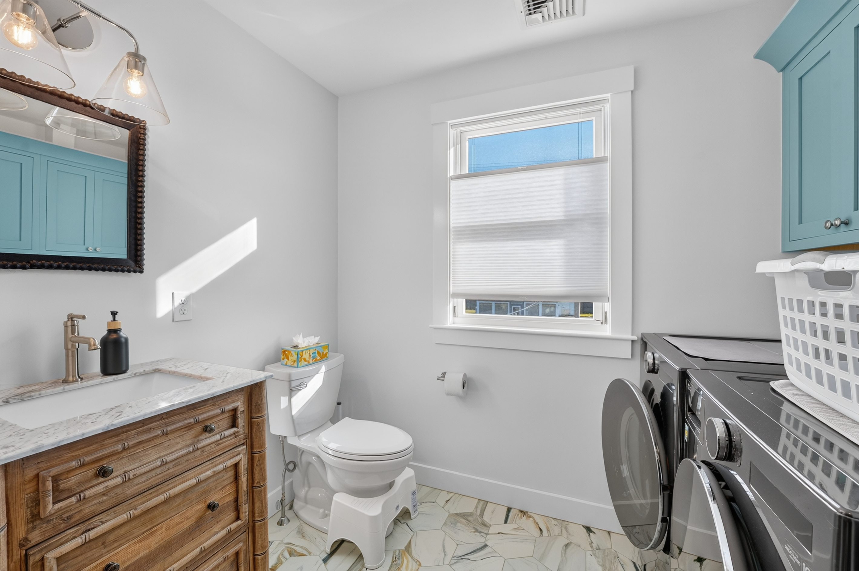 An in-home laundry area provides added convenience for both short and extended stays.