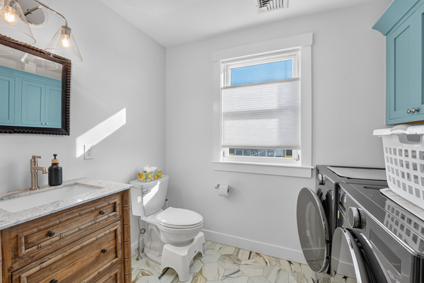 An in-home laundry area provides added convenience for both short and extended stays.