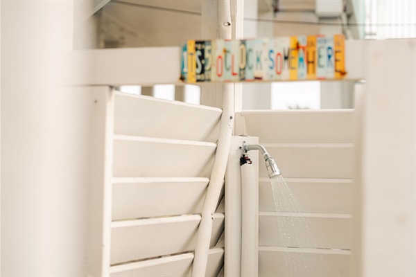 Outdoor shower — rinse the sand before you step back inside. 