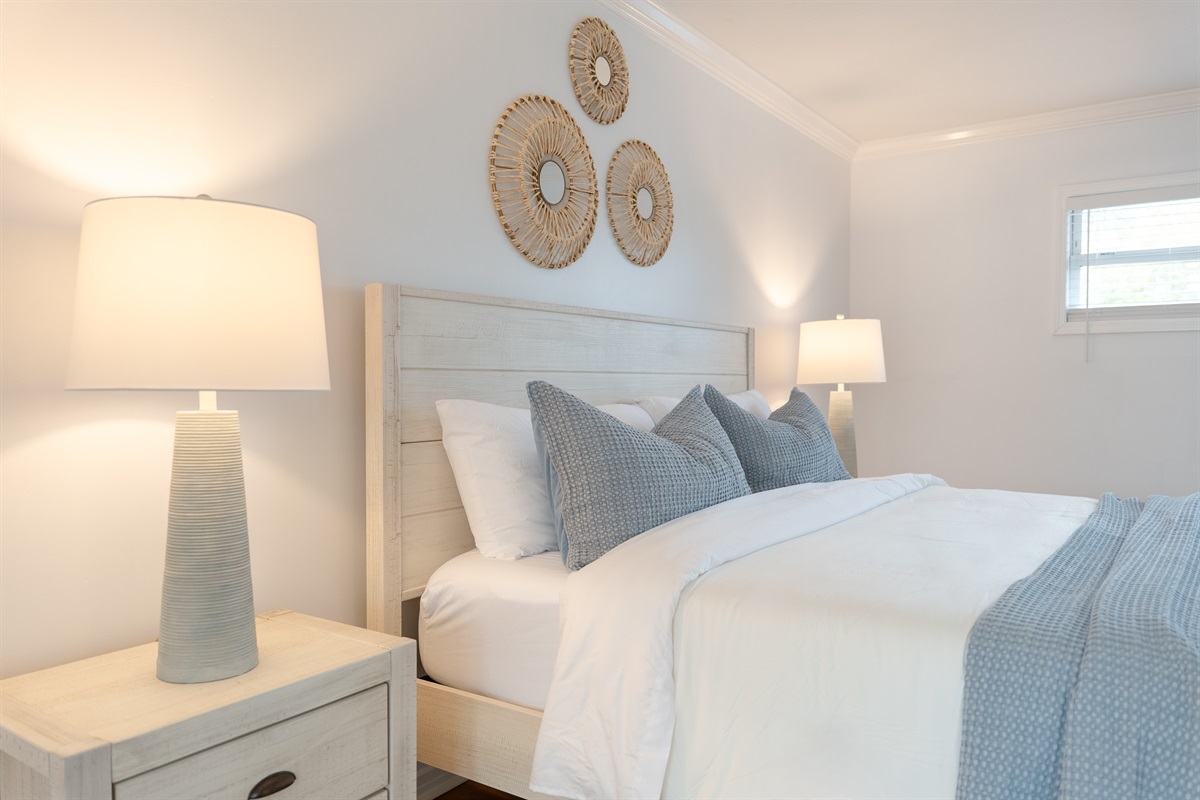 Soft coastal tones, fresh linens, and a peaceful atmosphere make this the perfect place to rest.