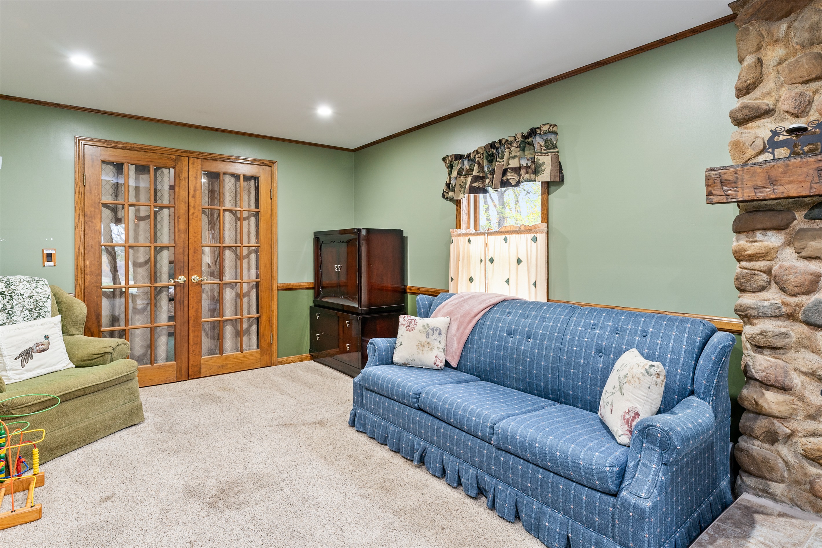 Relax in style with a blend of modern comfort and classic design, steps away from the dining area and kitchen.