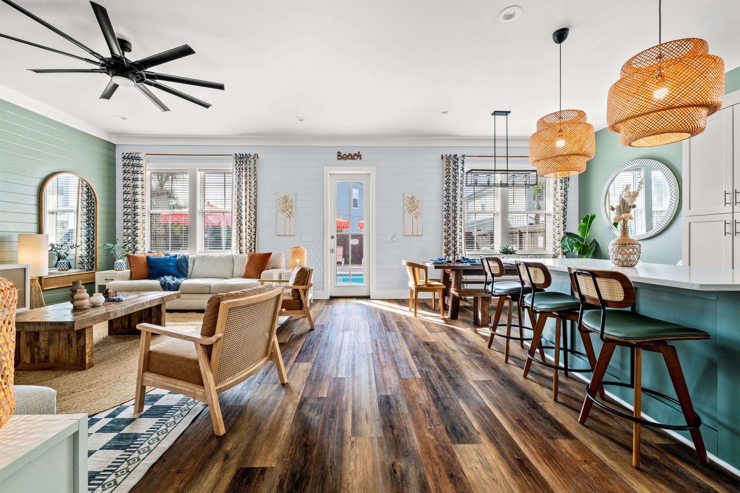 Open concept living makes vacation easy. Cook, gather, and relax together in this spacious coastal living area designed for families and groups.
