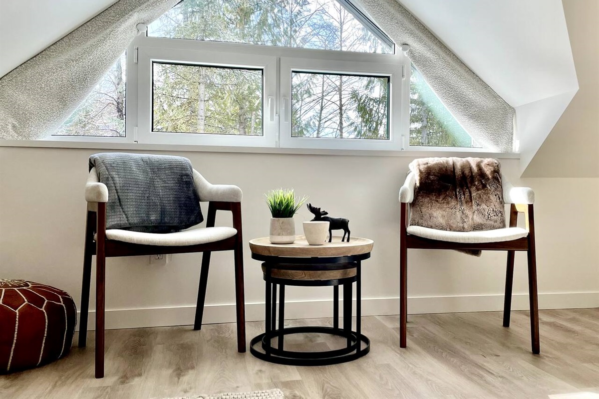 Top floor master bedroom seating area overlooks Whistler mountain, Fitzsimmons Creek and Excalibur Gondola. 