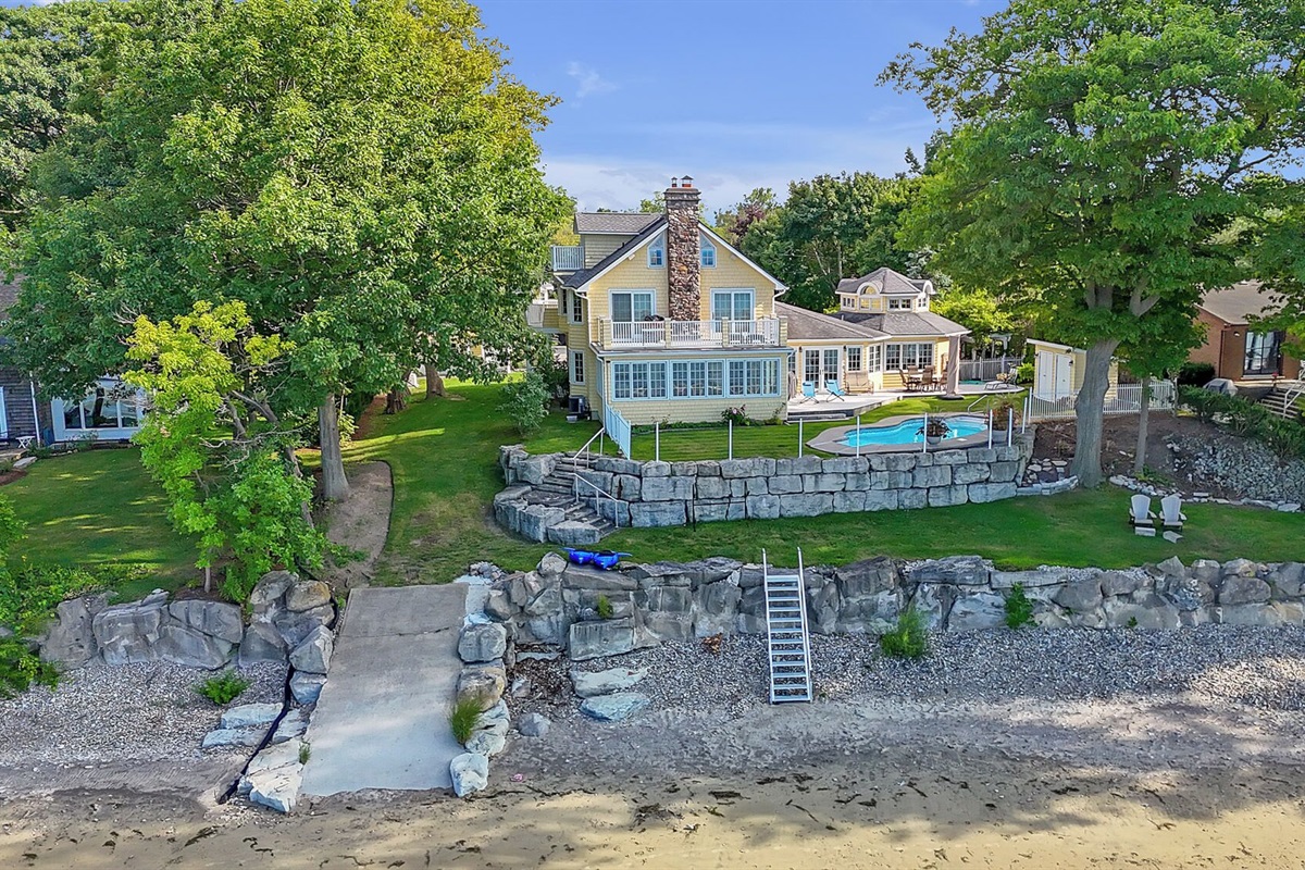Entrance to the beach from the left showing ramp or stairs.