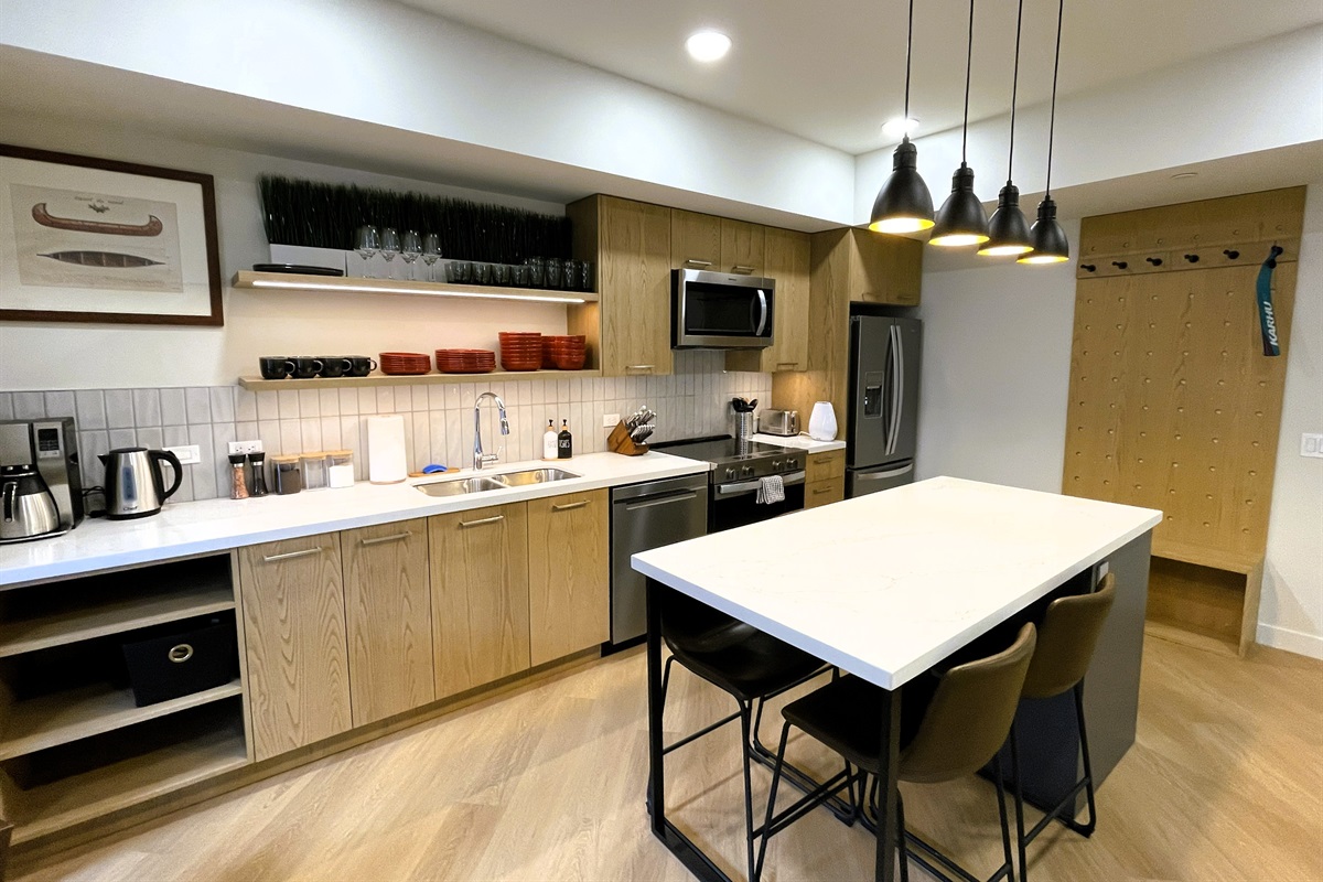 Comfortable seating for four by a granite breakfast bar centrally located in the kitchen area. High speed internet throughout the unit. 