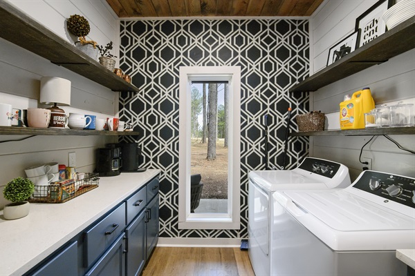 Large pantry/laundry room with washer/dryer and a coffee bar.