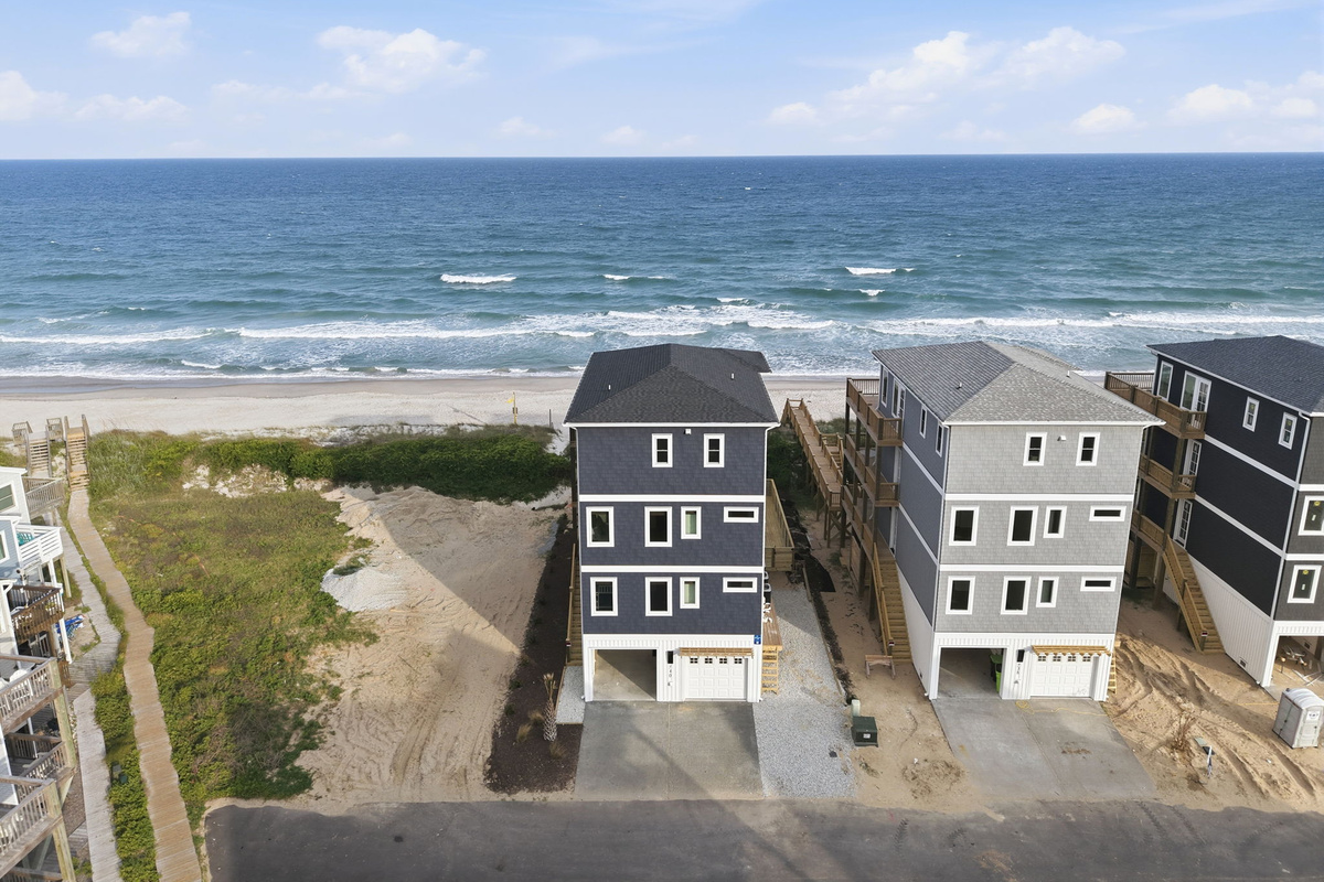 Oceanfront living at its best&mdash;this stunning beach home sits just steps from the sand with uninterrupted ocean views, a private boardwalk to the beach, and expansive decks designed for soaking in sunrise-to-sunset coastal scenery
