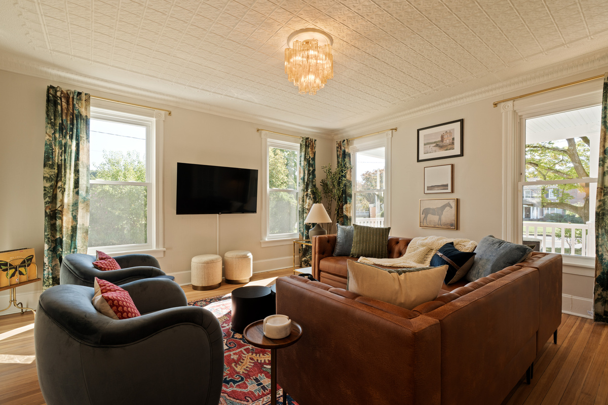 Plenty of room to gather without feeling crowded. The light-filled living space combines comfortable seating with the warmth and character of this historic village home.