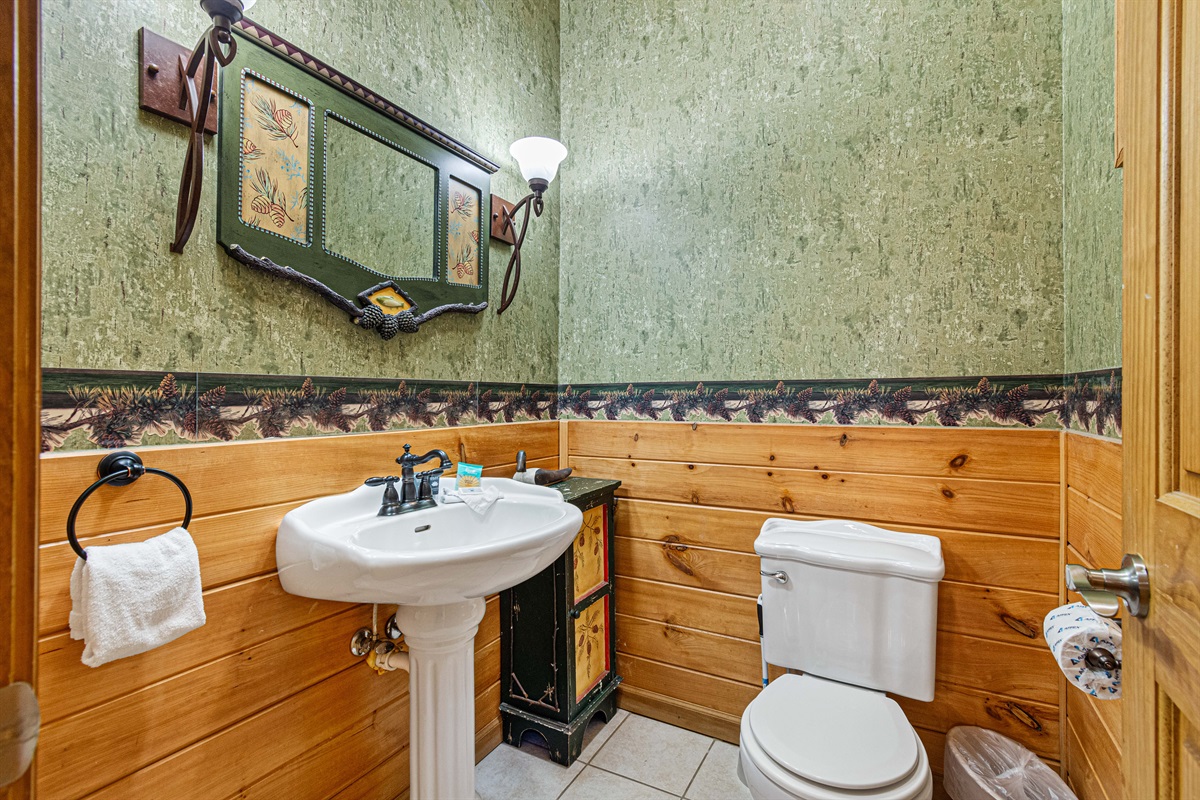 Convenient half bath upstairs at the top of the stairs.