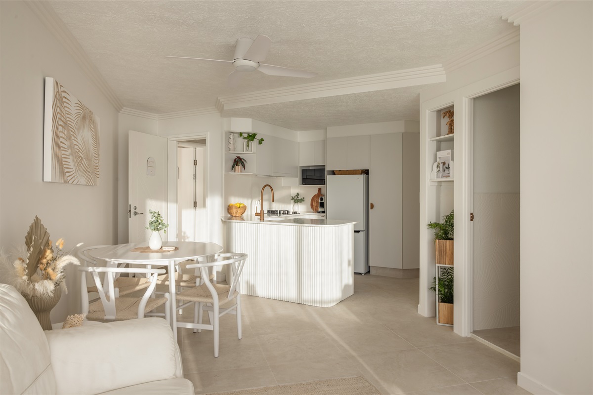 Open-plan coastal living with a beautifully styled kitchen & dining space.