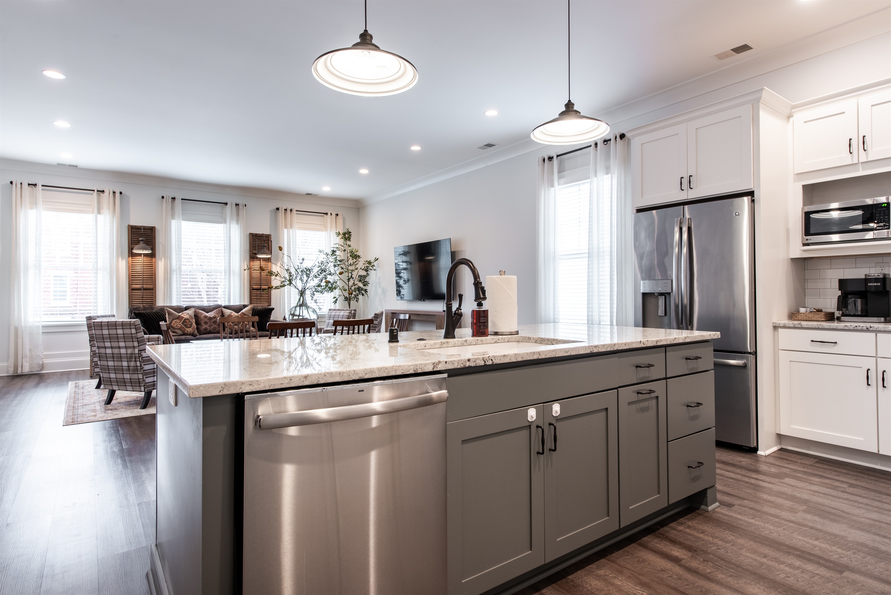 Open concept design connecting kitchen and living room, great for entertaining.
