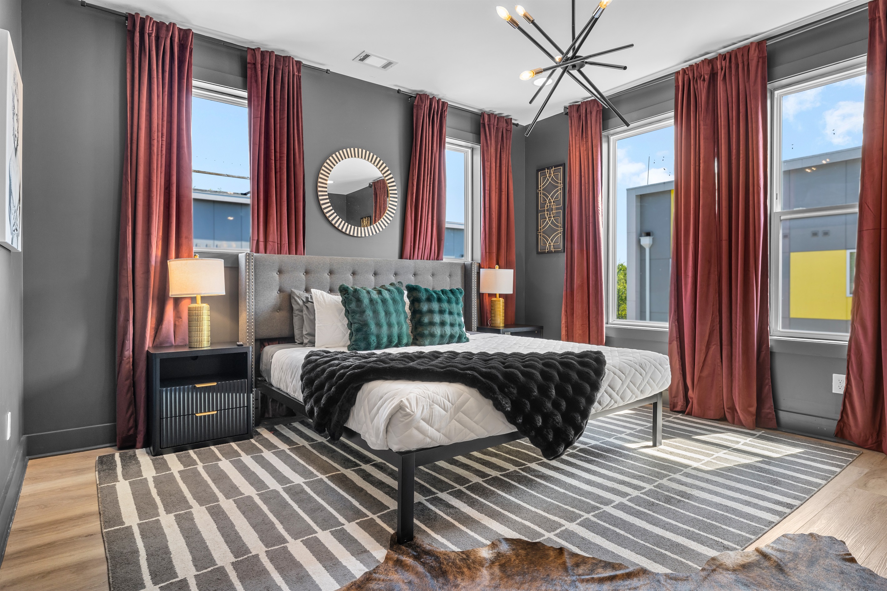 Chic Bedroom Retreat: Stylish decor, abundant light, and vibrant views await your Nashville escape!