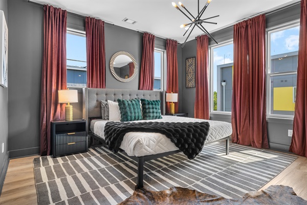 Chic Bedroom Retreat: Stylish decor, abundant light, and vibrant views await your Nashville escape!