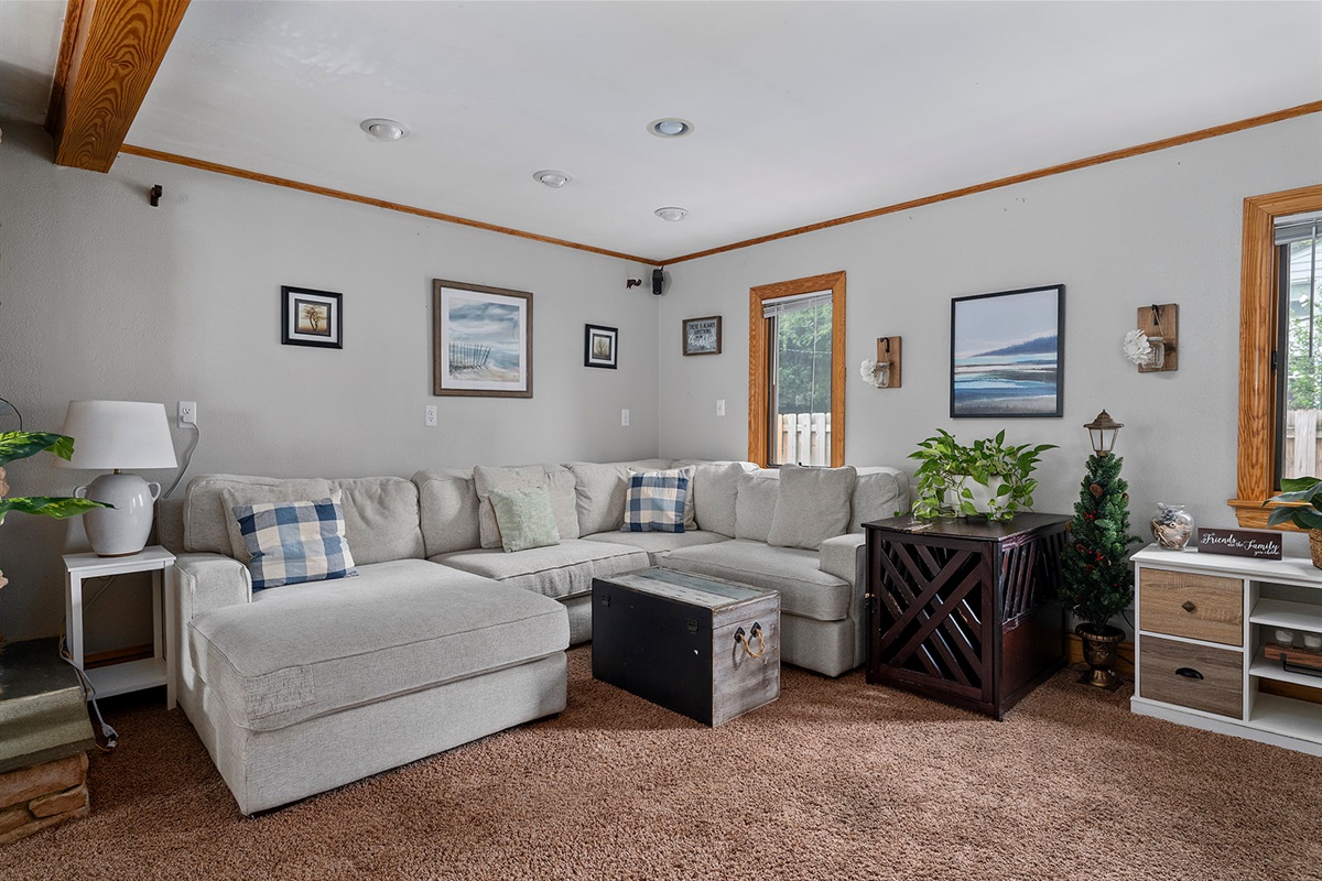 Living Room: Sun-soaked space with comfy seating, stylish decor, and a welcoming vibe!