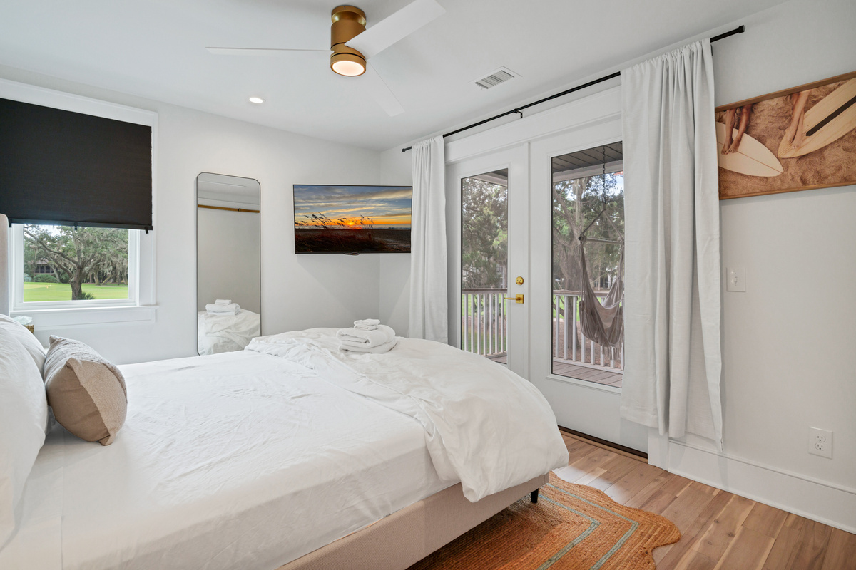 Guest Bedroom 4 on Main Level with TV and Private Entrance to Deck.  Queen Bed